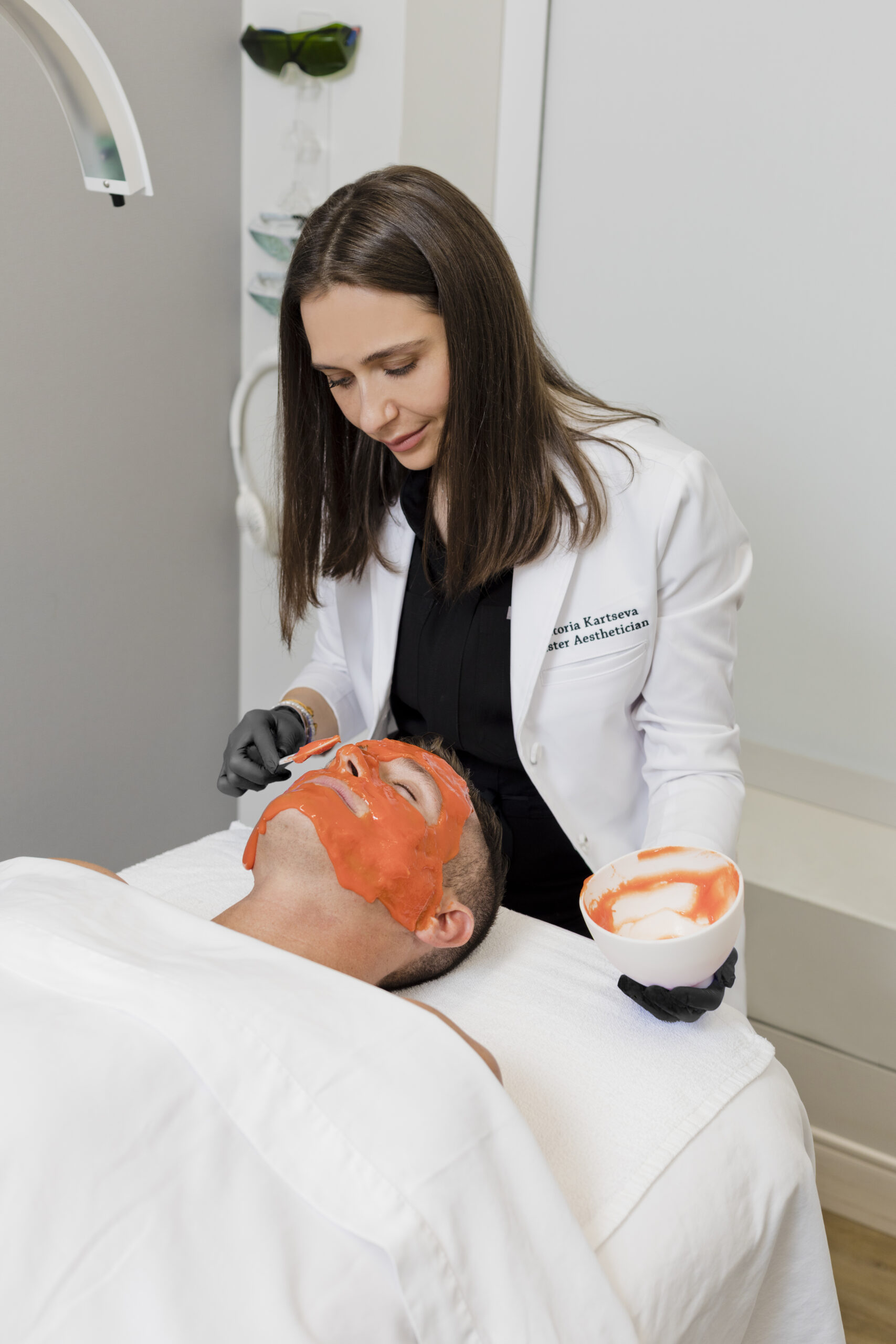 A man is receiving facial services in Washington, DC, at Ritual