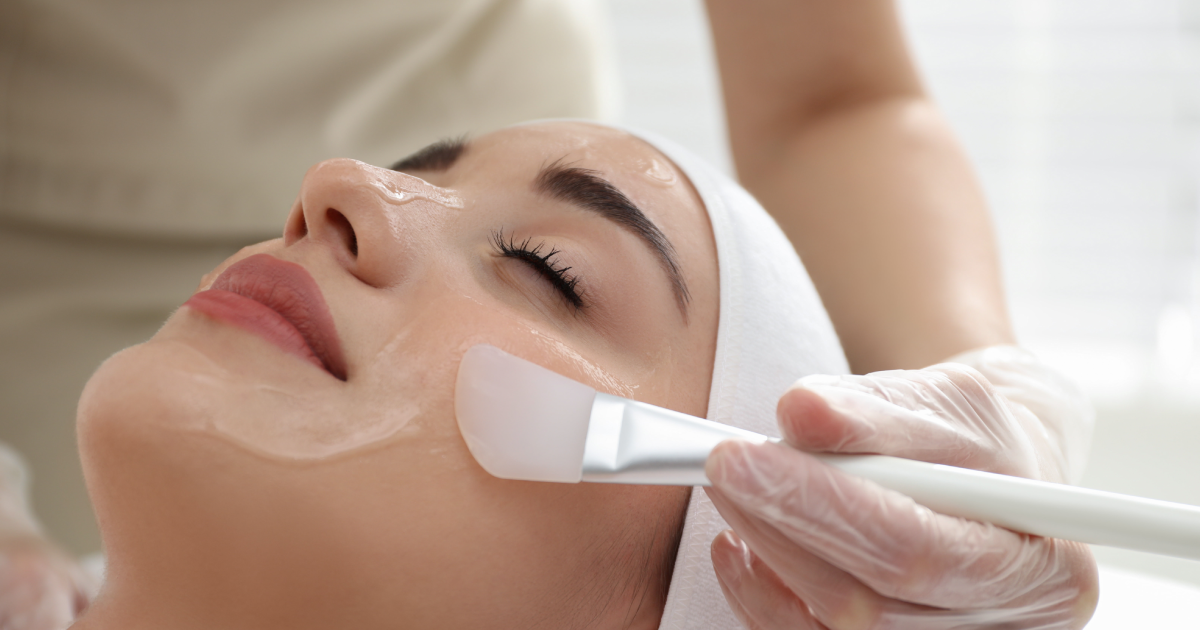 Doctor applying chemical peel to woman's face in Washington, DC